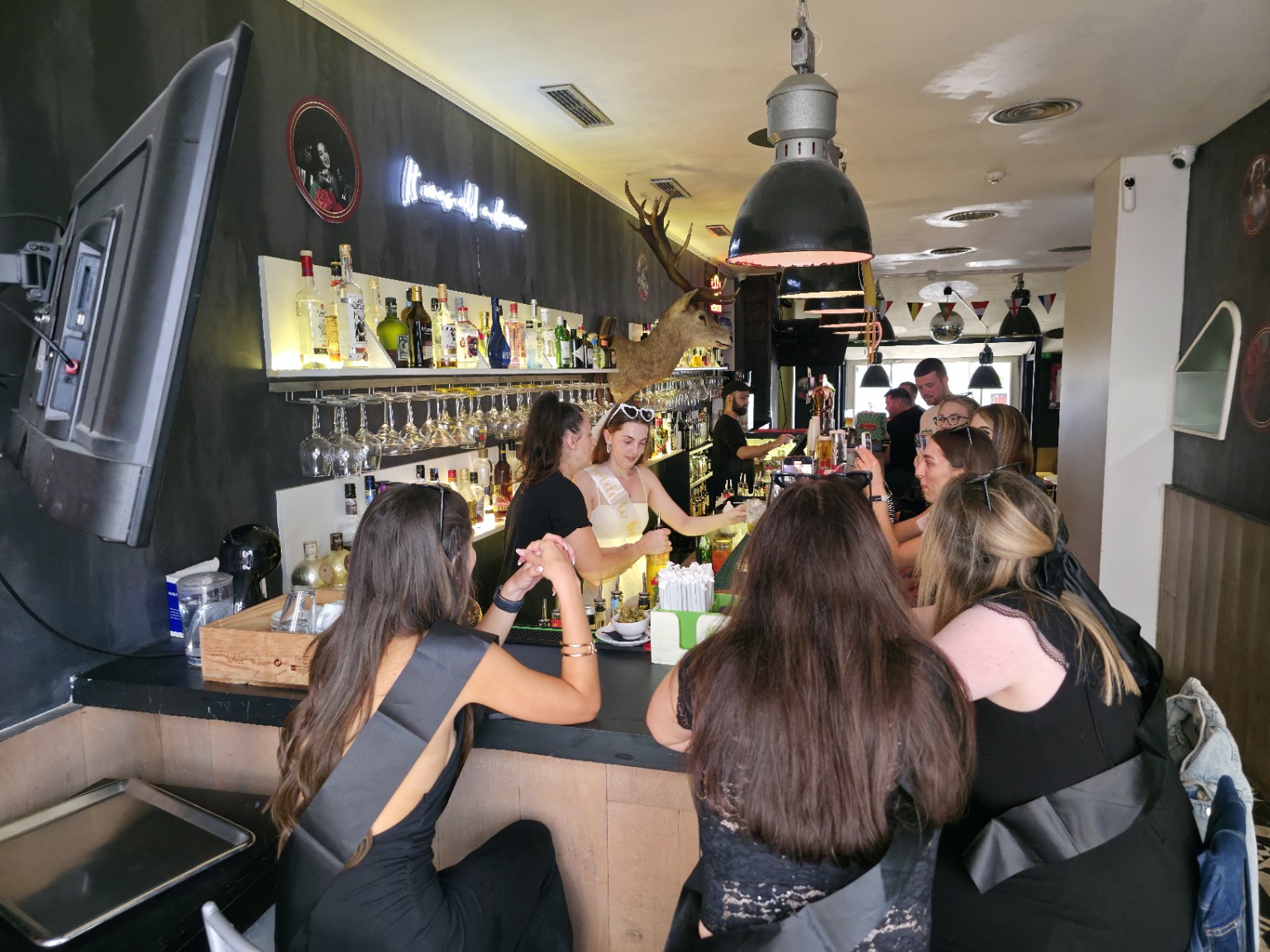 Guests taking part in a cocktail masterclass at The Spot Lisboa