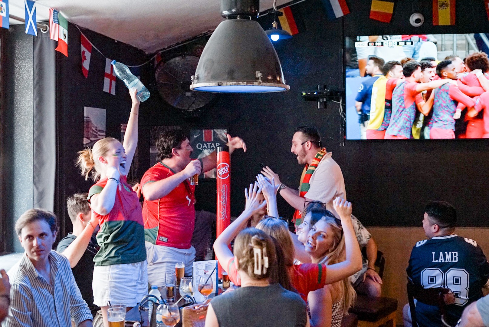 Fans watching live sports together at The Spot Lisboa