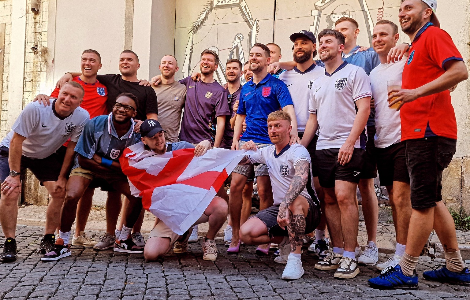 England football supporters gathering outside with their flag
